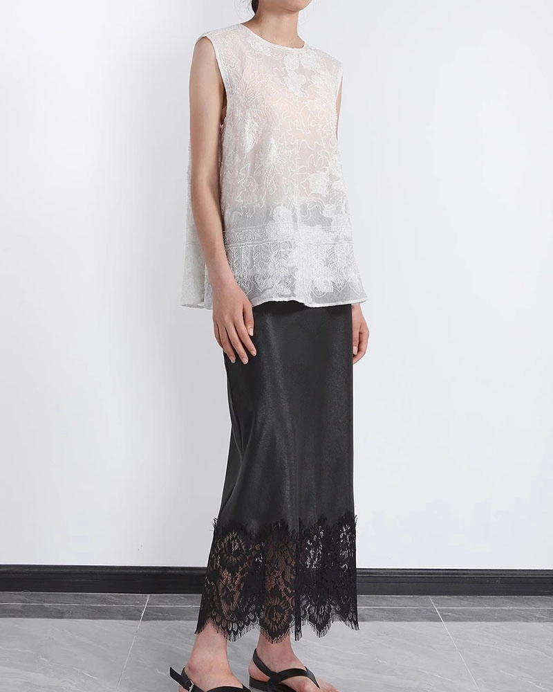 Luxury silk lace skirt with delicate floral embroidery, crafted by a premium custom clothing manufacturer.