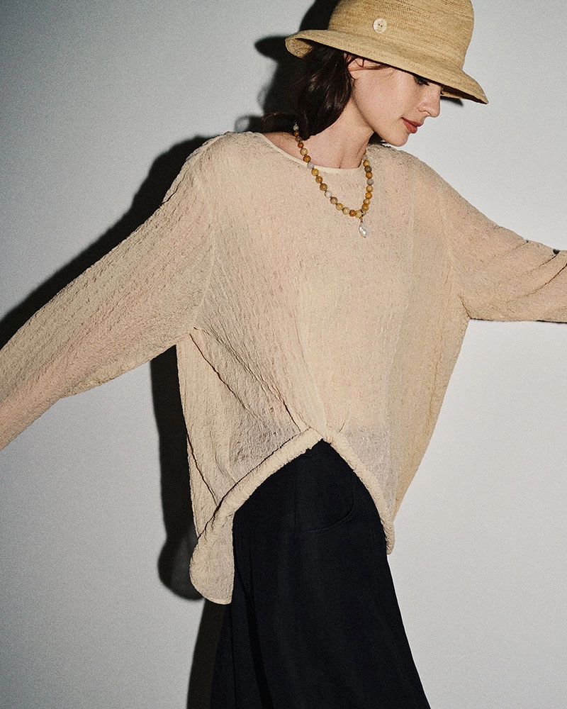 High-end women's fashion top made in China with curled trim detail