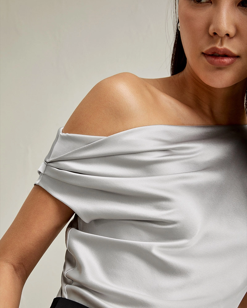 3D garment design preview of custom silk off-the-shoulder blouse, created for luxury women’s fashion brand.