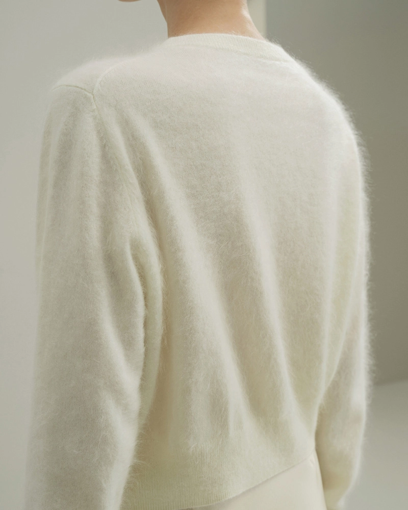 Women’s fashion at its finest: Soft, stylish Cashmere Cardigan Sweater in neutral tones.